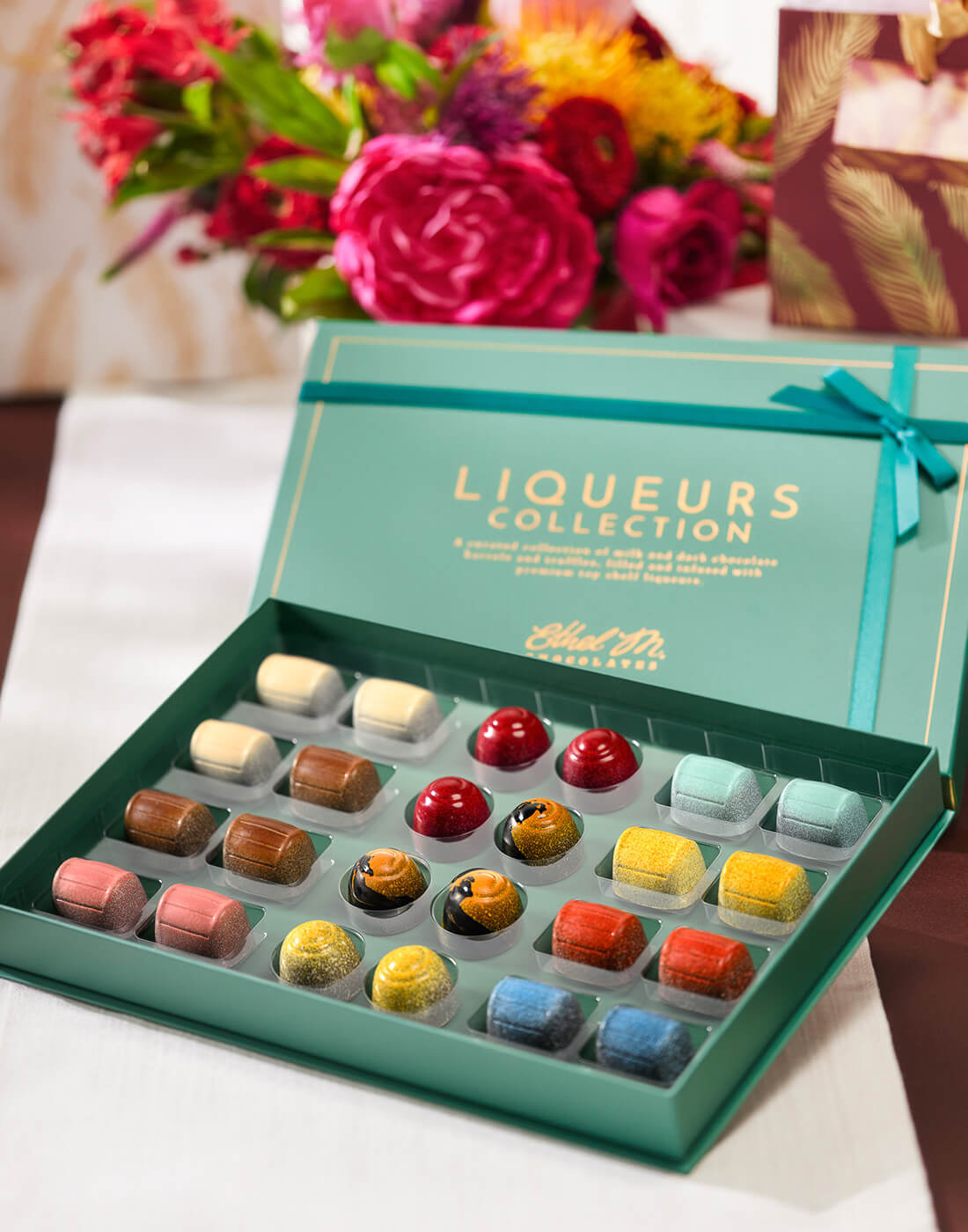 Ethel M Chocolates 24-Piece Liqueurs Collection opened box showing all unique liqueur gems.