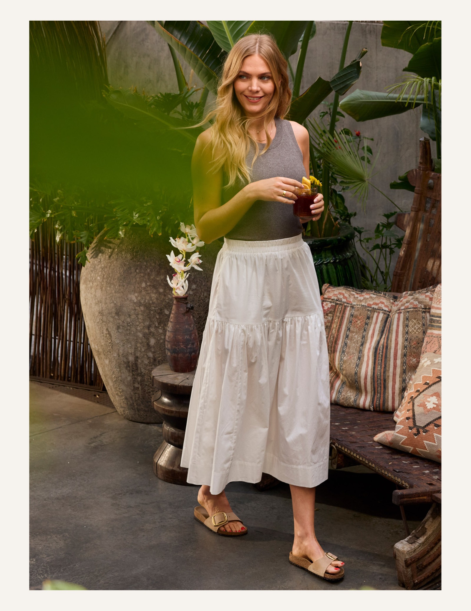 Image of woman in long white skirt.