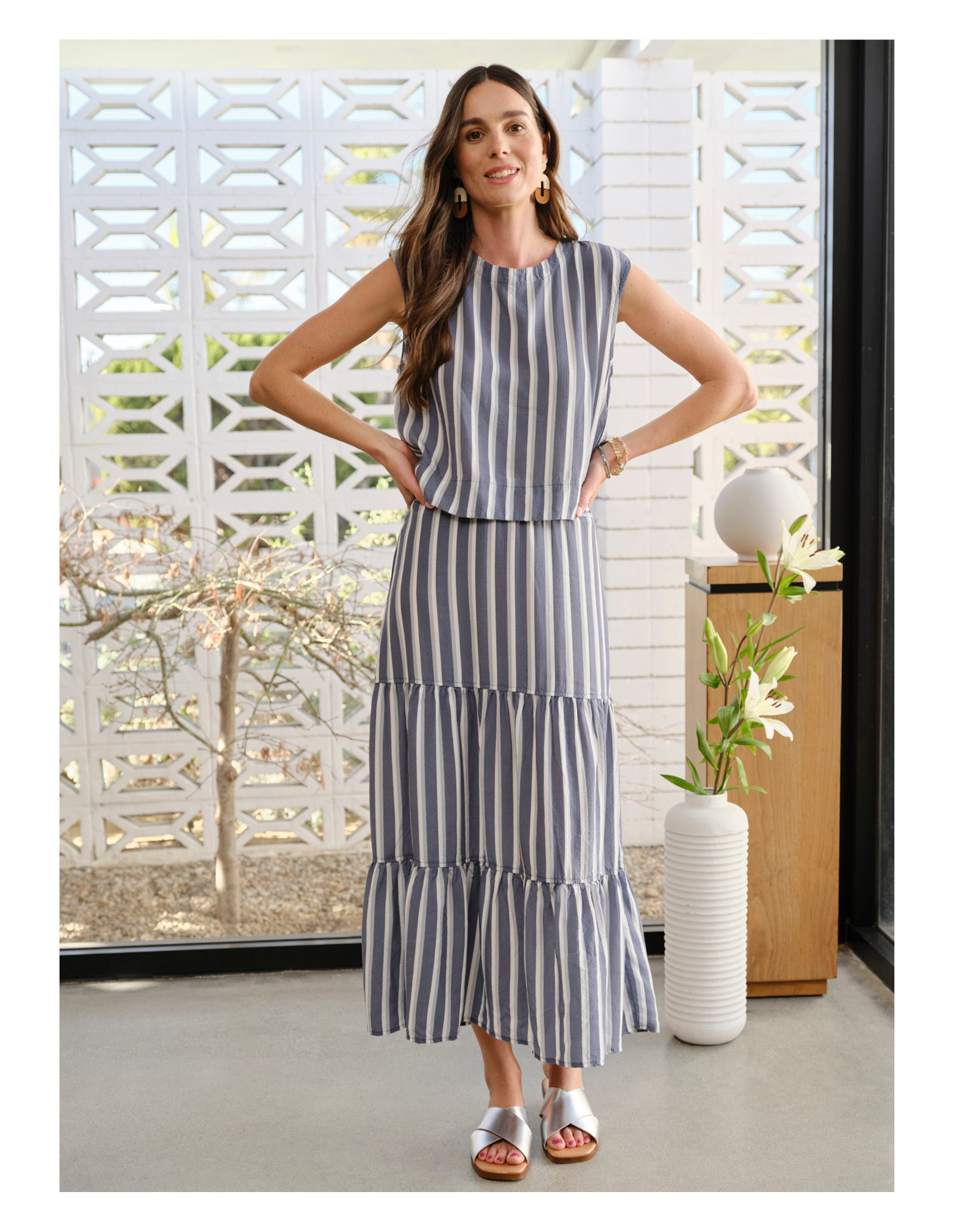 Image of woman in striped set. 