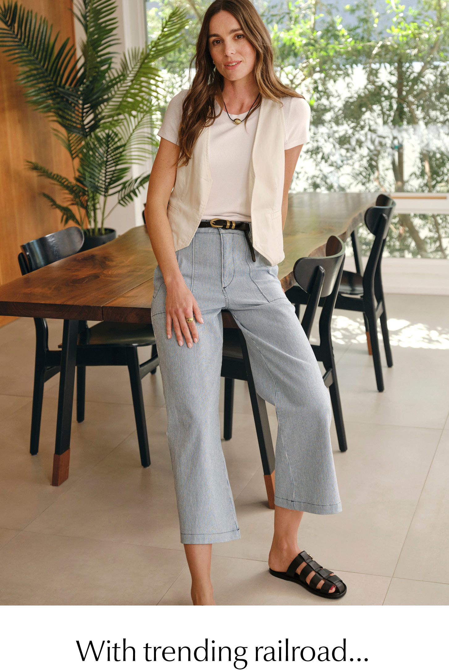 With trending railroad... Image of woman in striped crop jeans. 