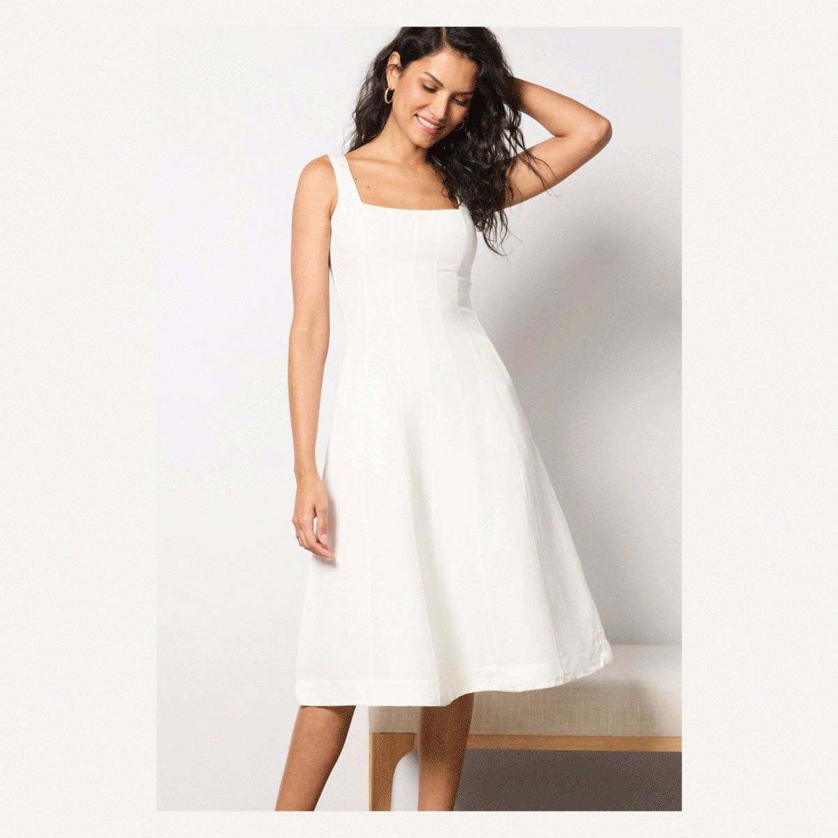 Rotating images of women in white dresses.