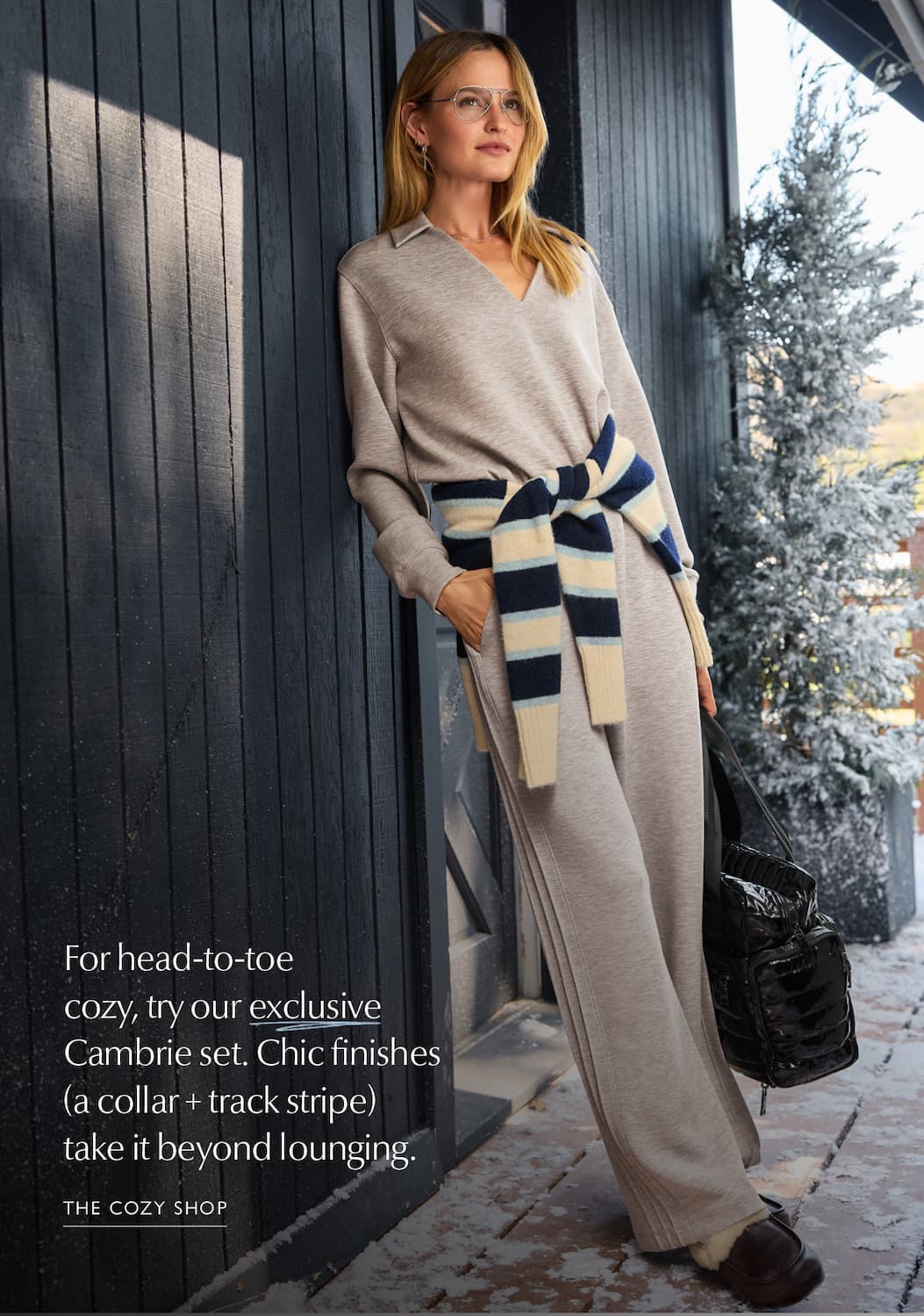 For head-to-toe  cozy, try our exclusive Cambrie set. Chic finishes (a collar + track stripe) take it beyond lounging. Image of woman in Cambrie set. SHOP COZY