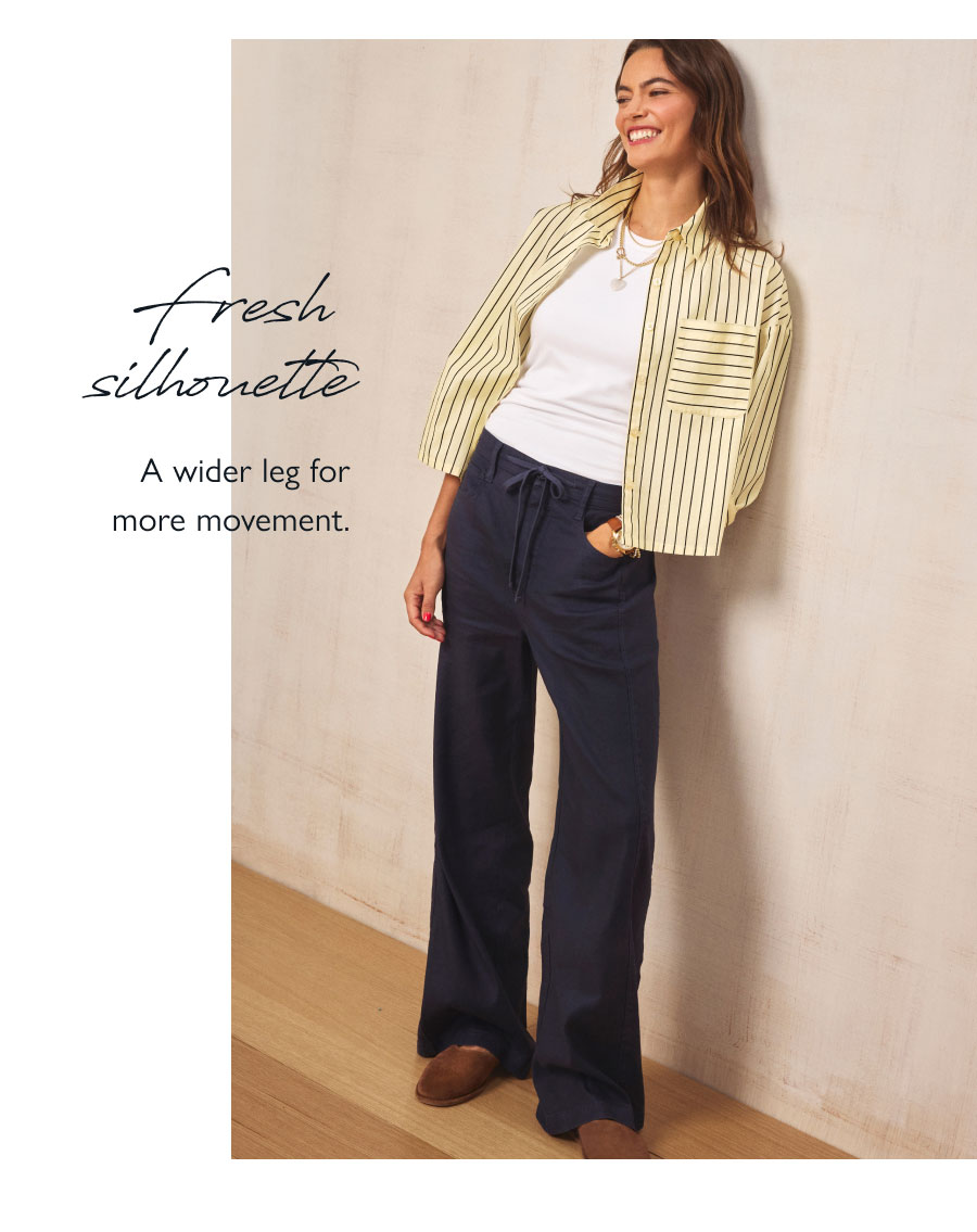 Fresh silhouette. A wider leg for movement. Image of model in Joelle pant and button down top.