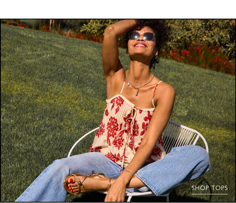 Fashion image of model in new look. SHOP TOPS