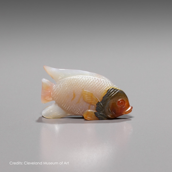 Fabergé goldfish decorative object crafted from carved hardstone, featuring a pink body, showcasing the House's renowned artistry and craftsmanship.