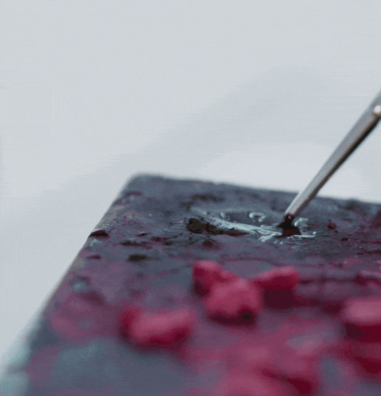 Behind-the-scenes process showing the design and hand-crafting stages of a Fabergé egg pendant