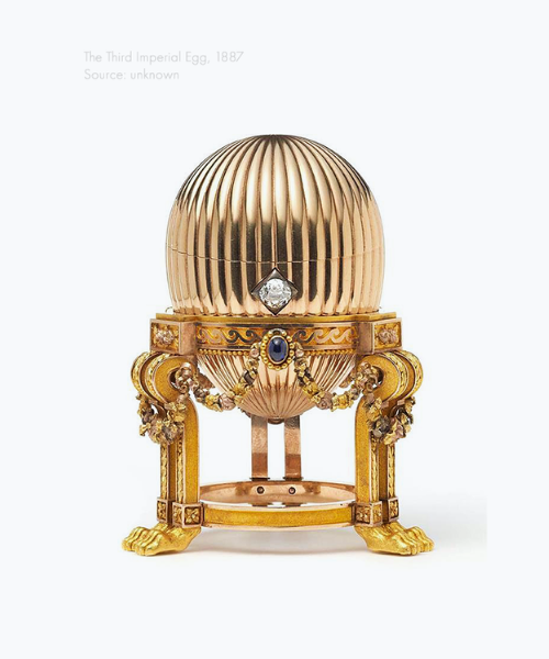 The Third Imperial Egg from 1887, featuring fluted gold, a solitaire diamond clasp, and ornate gold tripod legs