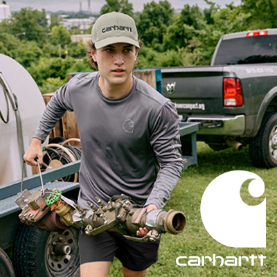 Young man working on the farm wearing a carhatt hat and shirt.