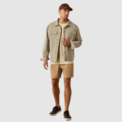 Man wearing khaki shorts and shirt