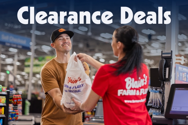 Man selecting tools, happy with the clearance deals he's finding