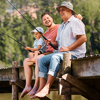 Group of guys fishing, feeling glad they bought their fishing license from Blain's