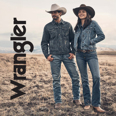 Man and woman in Wrangler clothing looking peacefully over the horizon