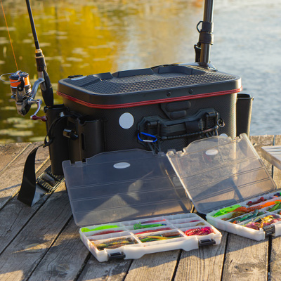 Fishing tackle boxes, poles, and a nifty looking black cooler