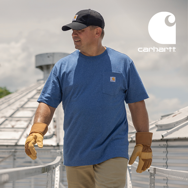 Man wearing a light blue Carhartt tee and black hat