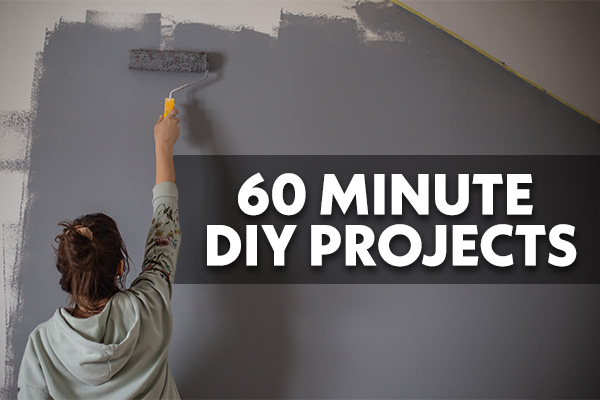 Woman painting a wall gray