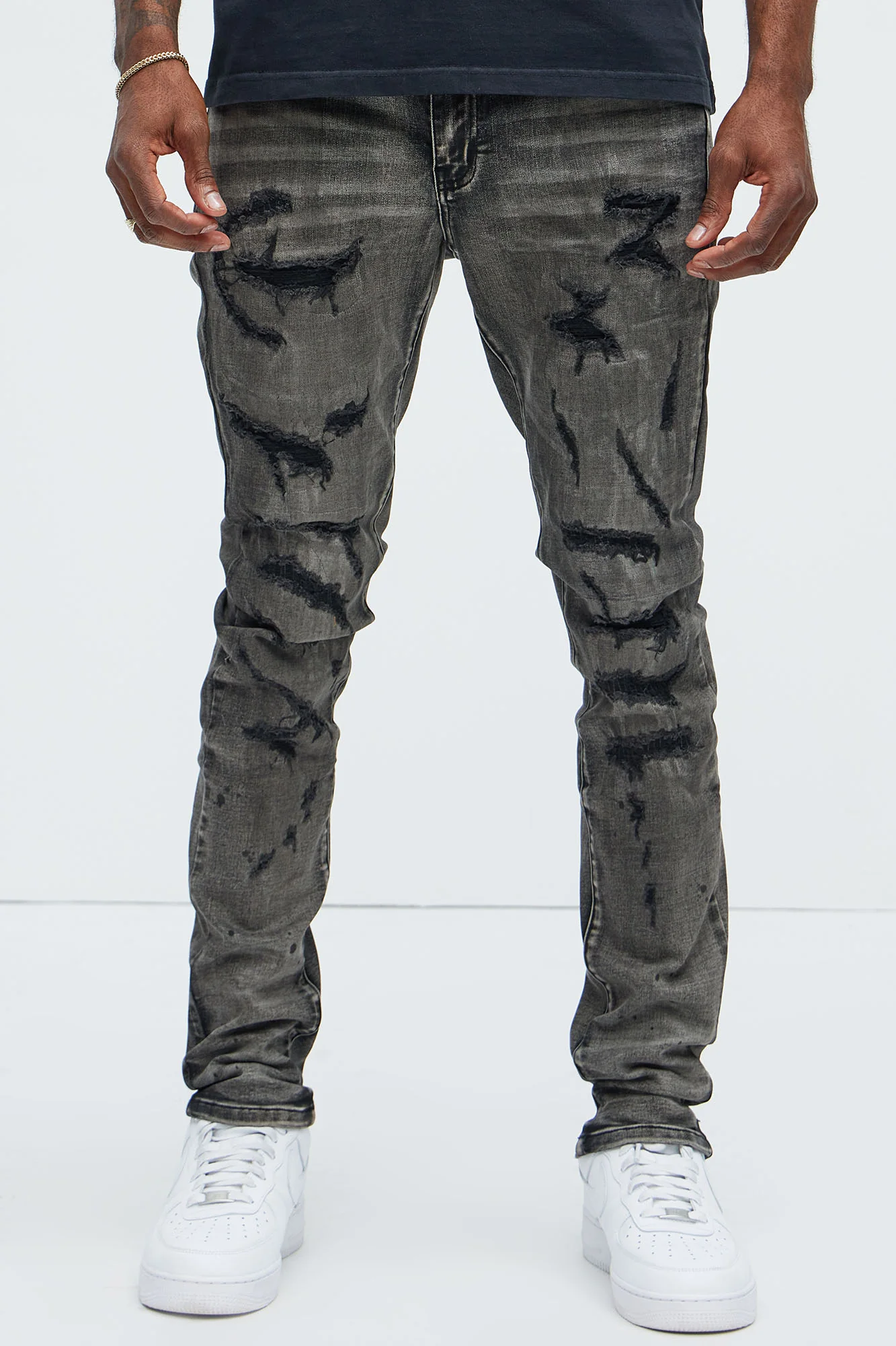 Image of Put You On Spray Painted Stacked Skinny Jeans - Black