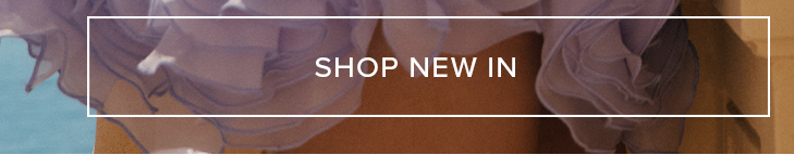 Flowing light lavender fabric from new apparel, layered over warm brown tones. A white text box reads, "SHOP NEW IN" for latest arrivals.