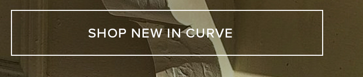Subtle background featuring a woman's form in earthy hues. 'Shop New In Curve' invites users to explore the latest plus size collection.