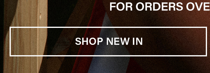 Stylish person in new dark clothing next to wood, promoting the latest fashion collection. Shop New In to see new arrivals and discover current offers.