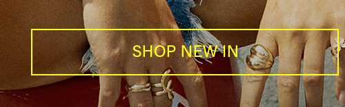 SHOP NEW IN: Hands wearing trendy gold rings. Heart & abstract designs. New fashion jewelry arrivals.