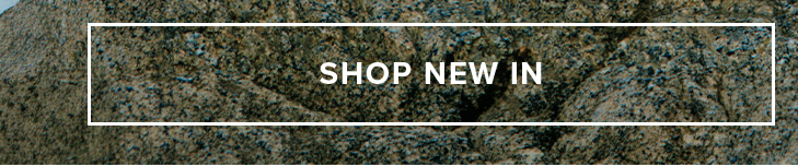 Shop New In button. Dark granite background.