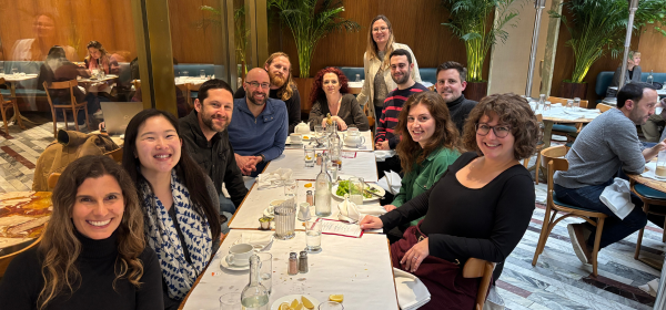 Image of Final Draft Big Break Screenwriting Contest Winners sitting at a table on a patio at Bottega Louis with some of the best managers in the business