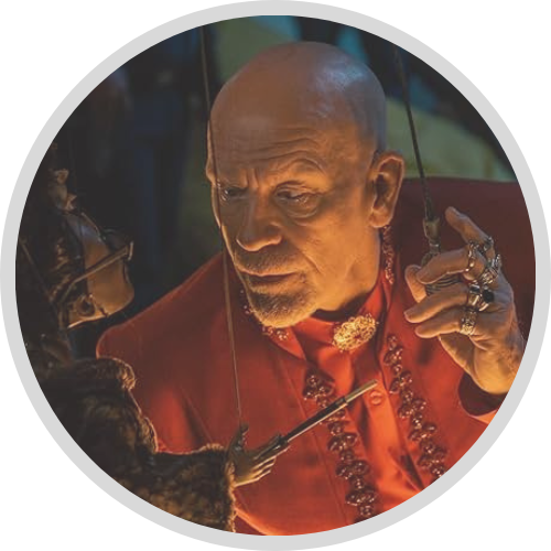 John Malkovich leaning over a marionette in Opus (1)