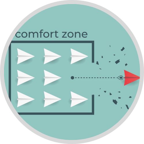 Image of white paper planes sitting inside of a box. A red paper plane busts through the side of the box symbolizing getting out of your comfort zone 