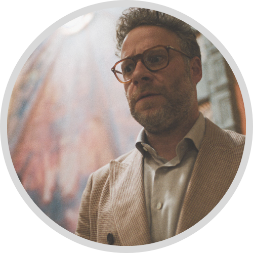 Seth Rogen wearing glasses and a tan suit in The Studio