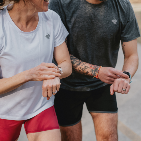 Man and woman wearing Garmin watches