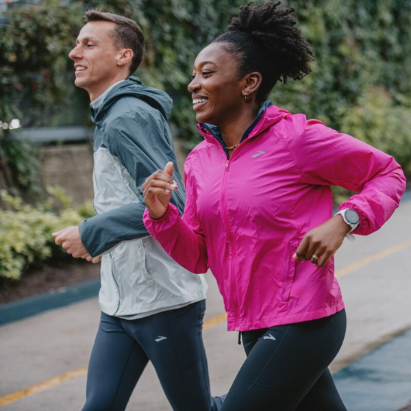 Man and woman wearing Brooks apparel