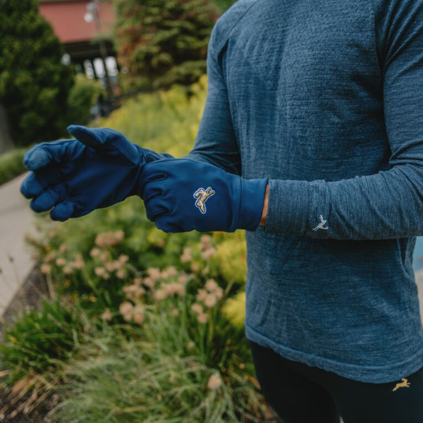 Man wearing Tracksmith gloves