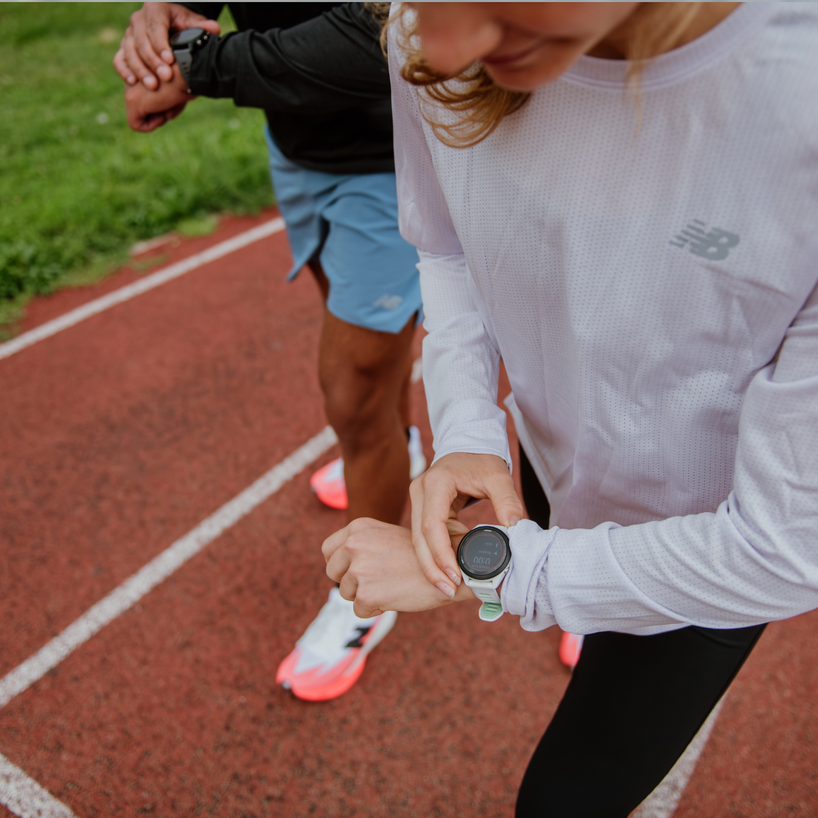Runners looking at Garmin watch