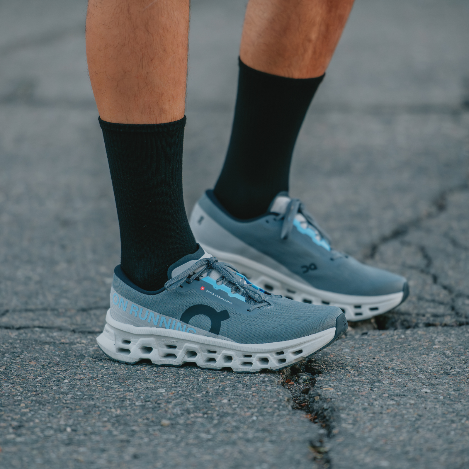 Man standing wearing On socks and shoes