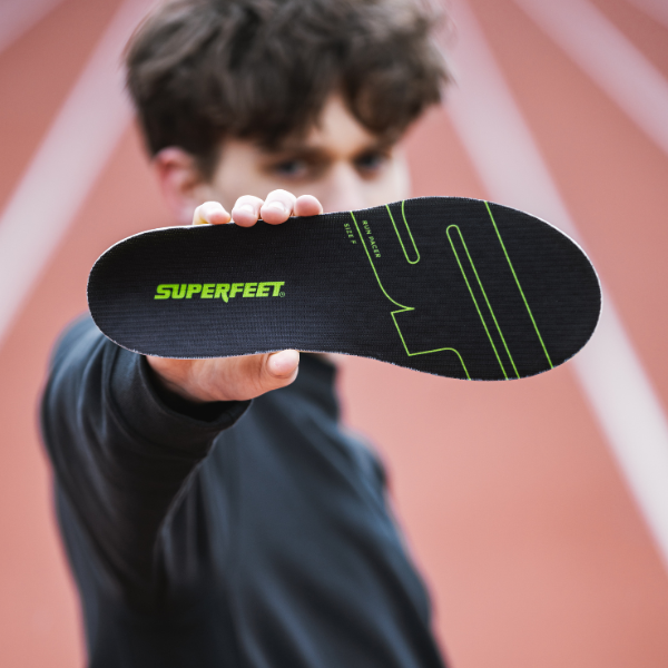 Man holding a Superfeet Run Pacer insole