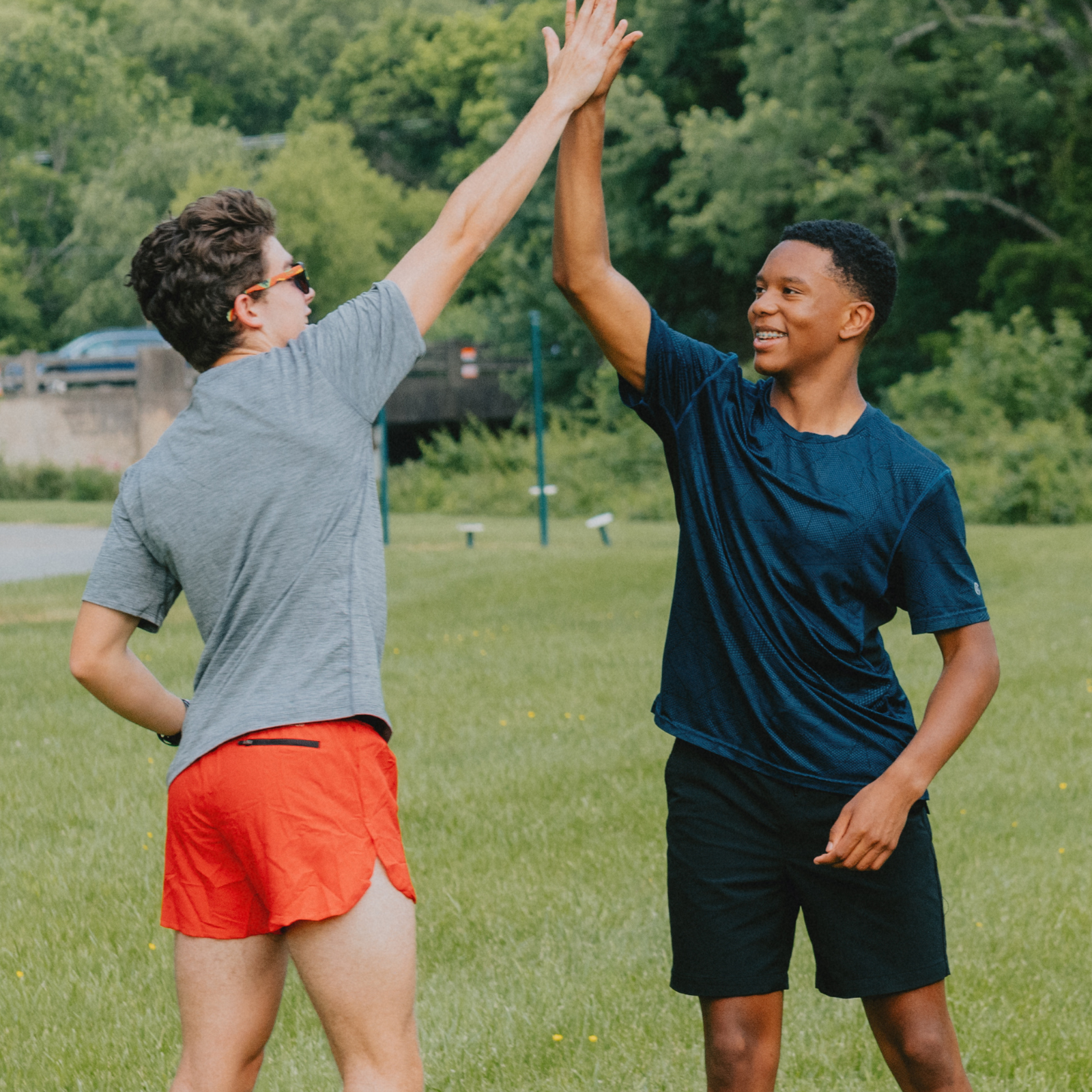 Two runners high-fiving