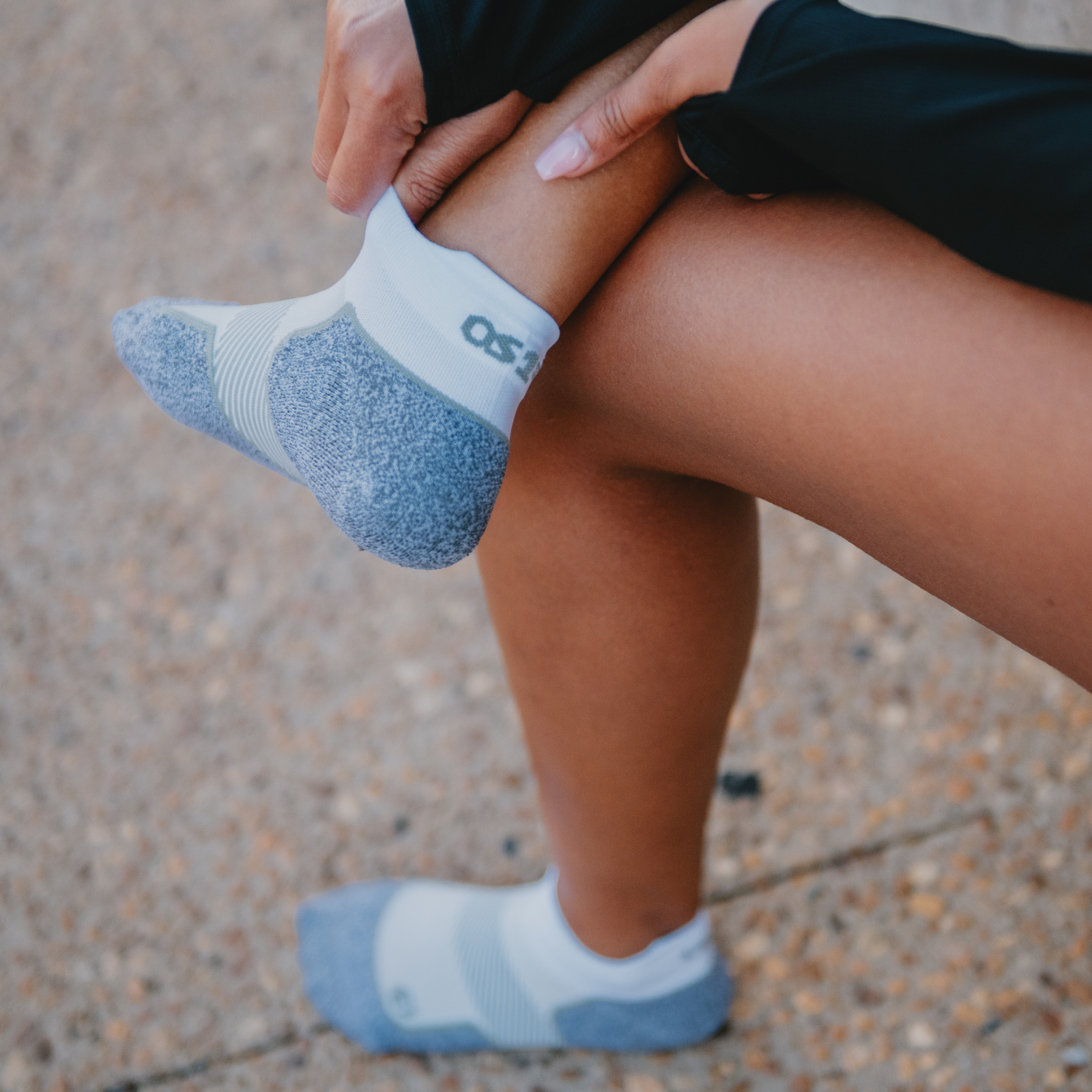 Woman putting on socks