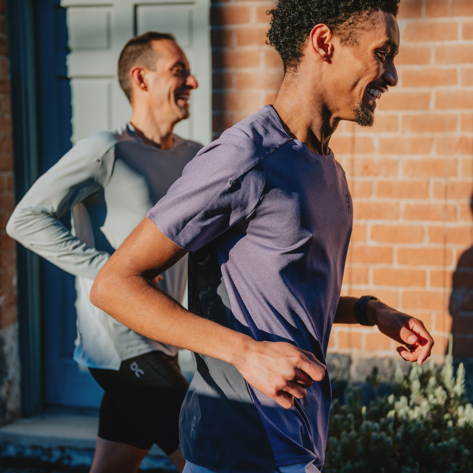 Two men running in On apparel