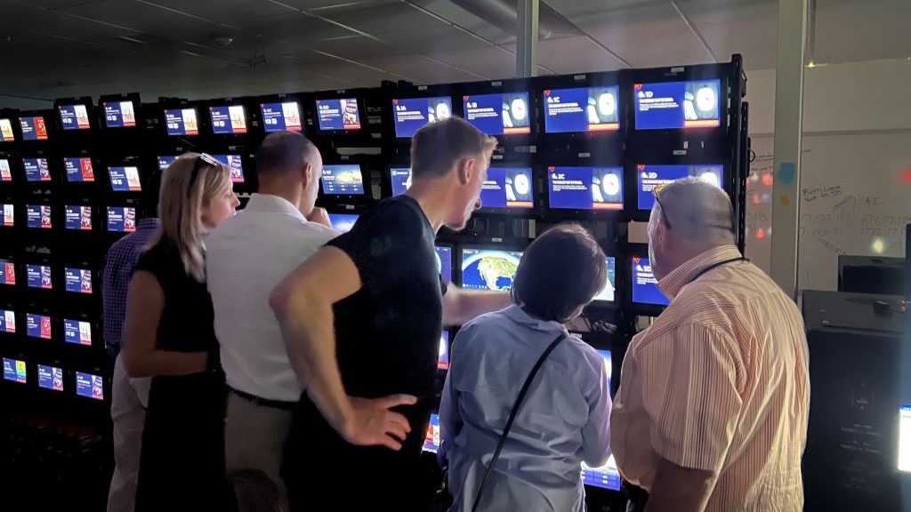 Members of the Advisory Board on Disability test Delta's new flight map in the In-Flight Entertainment lab.