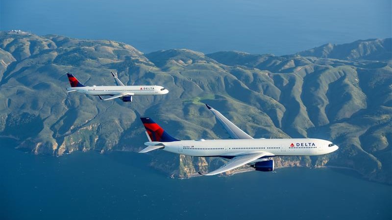 Two Airbus jets flying in formation