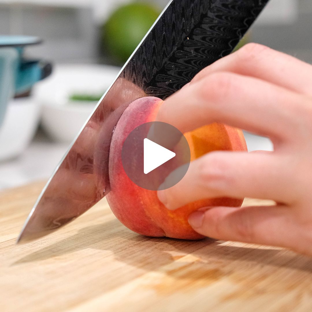 F.N. Sharp Chef's Knife slicing a peach