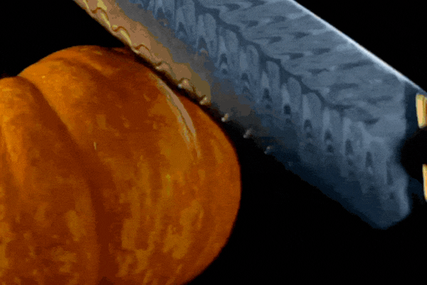 Animated gif of an F.N. Sharp knife slicing a pumpkin in half