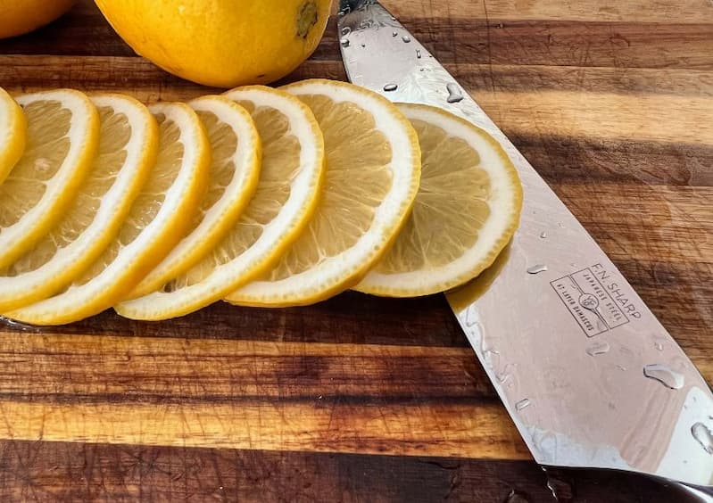 F.N. Sharp Chef's Knife with whole and sliced lemons