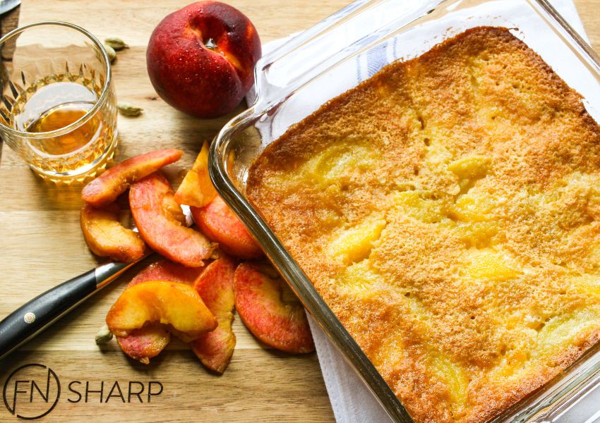 Recipe for homemade peach cobbler with bourbon, cardamom and ginger