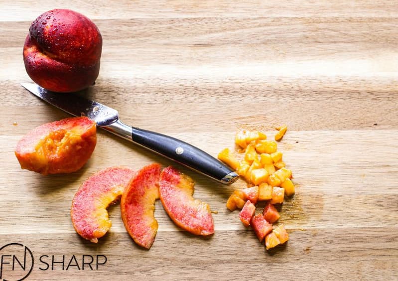 F.N. Sharp Paring Knife with whole, sliced and diced peaches