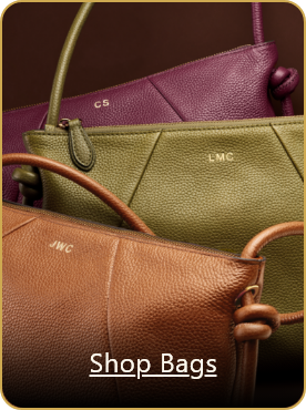 Image of multiple womens leather handbags in various colors with on-image text that reads 'Shop Bags'.