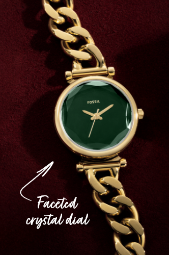 Gold jewelry-inspired watch with green dial on burgundy background, featuring “Faceted Crystal Dial” callout on the image