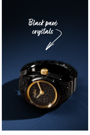 Close-up of a Black and gold watch ring on dark blue background with callout text “black pave crystals” highlighting sparkling details