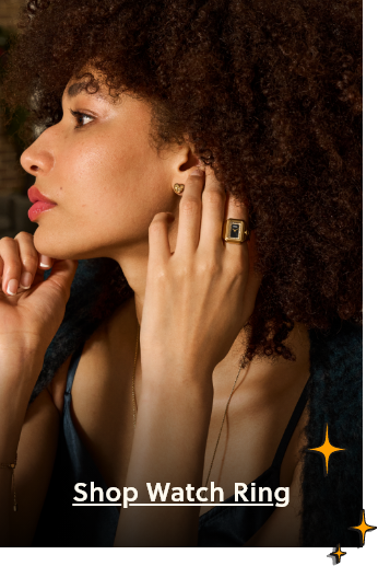 Profile of a woman dressed up with red lipstick and gold heart earrings, wearing a black and gold ring watch with a call to action to “Shop Watch Ring