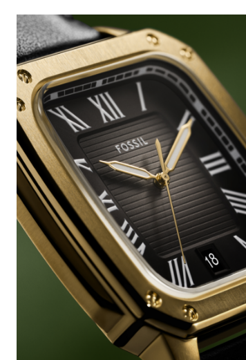 Angled close-up of the new Crosby watch featuring a black dial and gold case